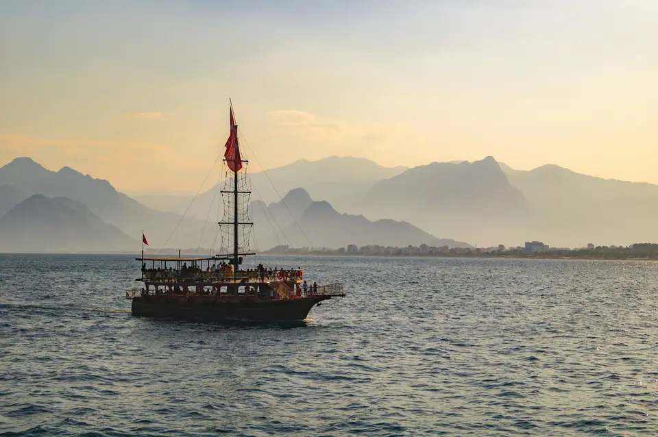 Wooden boat in the Gulf of Antalya at sunset