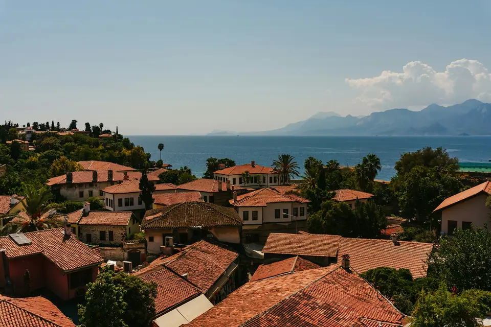 Red roofs of Antalya with the sea and mountains behind