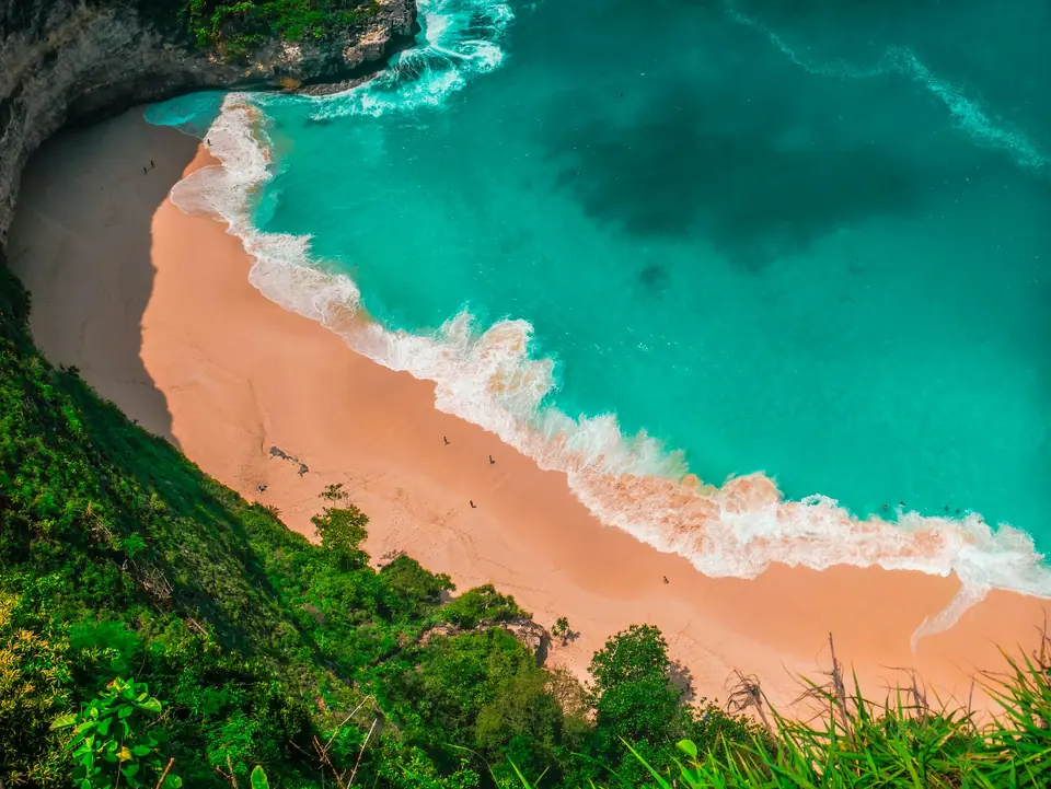 Turquoise bay below cliffs in Bali
