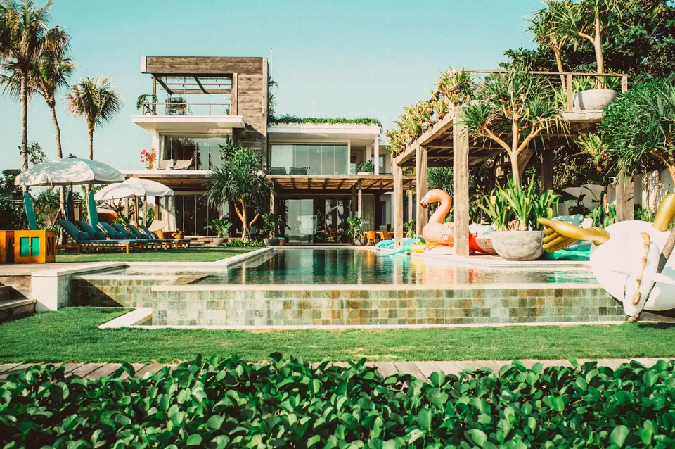 Villa pool among palms in Bali
