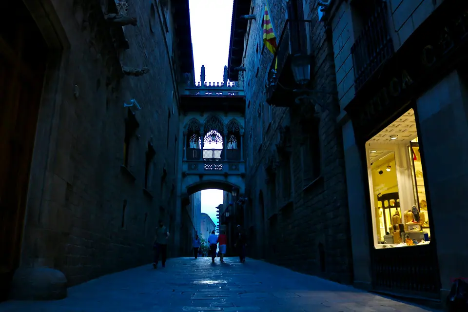 Narrow lane and bridge in the Gothic Quarter of Barcelona
