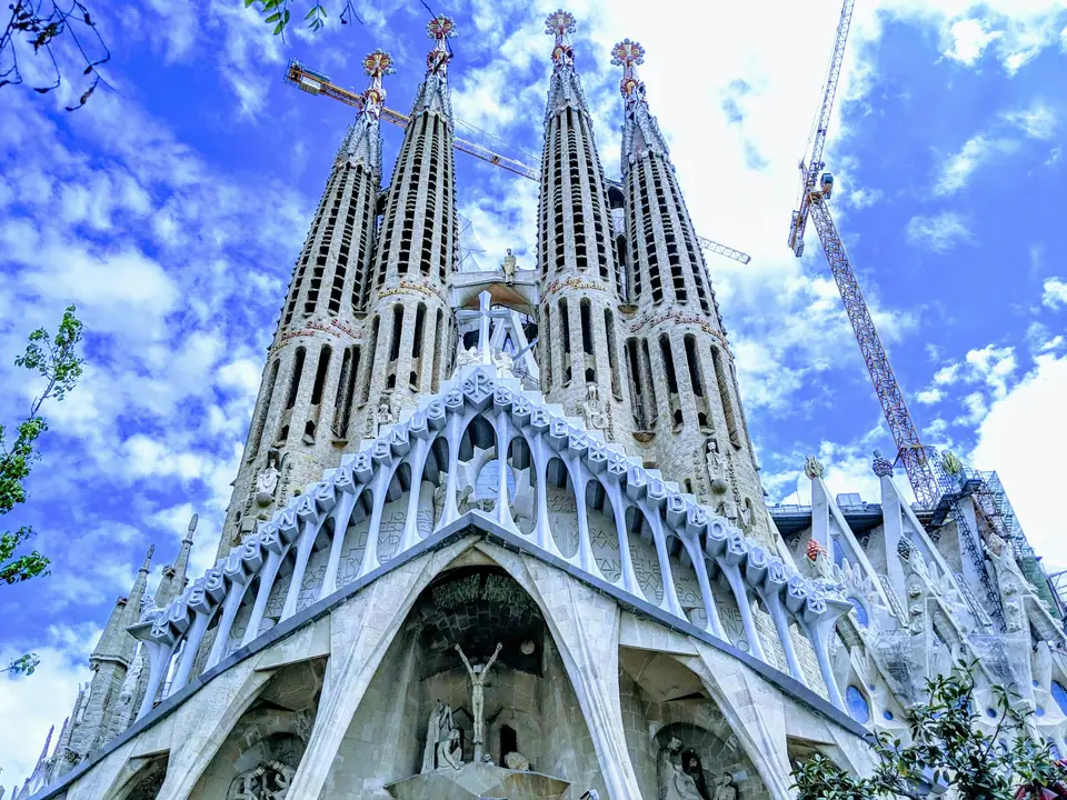 Towers of the Sagrada Familia against a blue sky