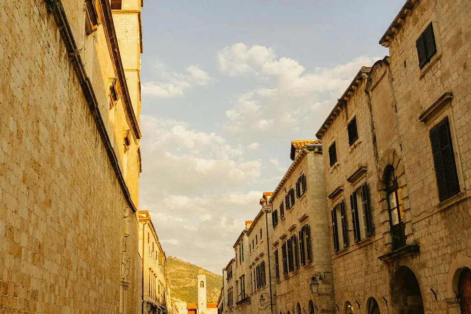 Narrow stone street in Dubrovnik Old Town under a clear sky
