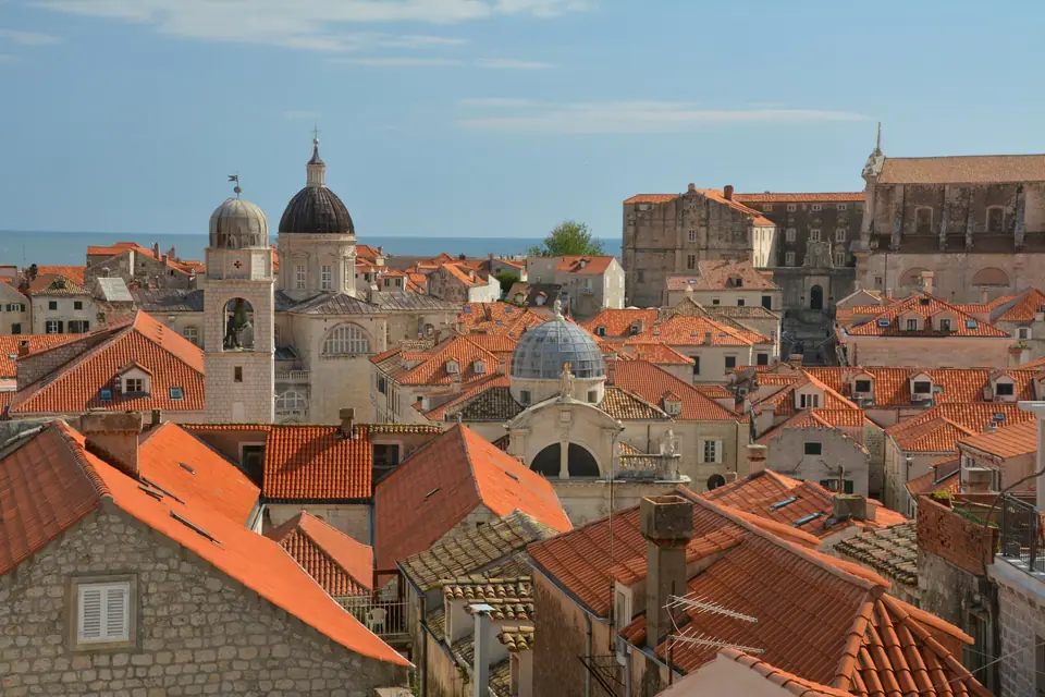 Terracotta roofs and church domes inside Dubrovnik Old Town