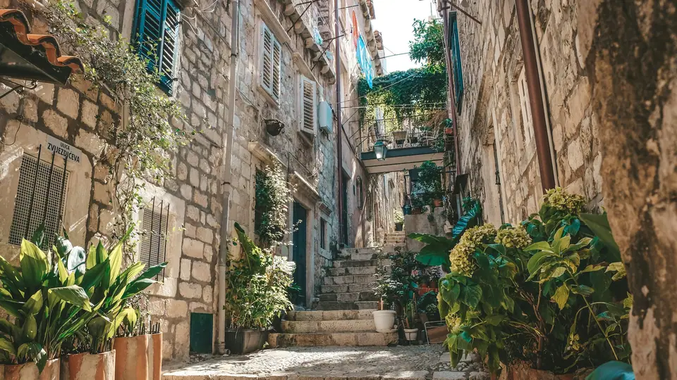 Stepped stone lane with potted plants in Dubrovnik Old Town