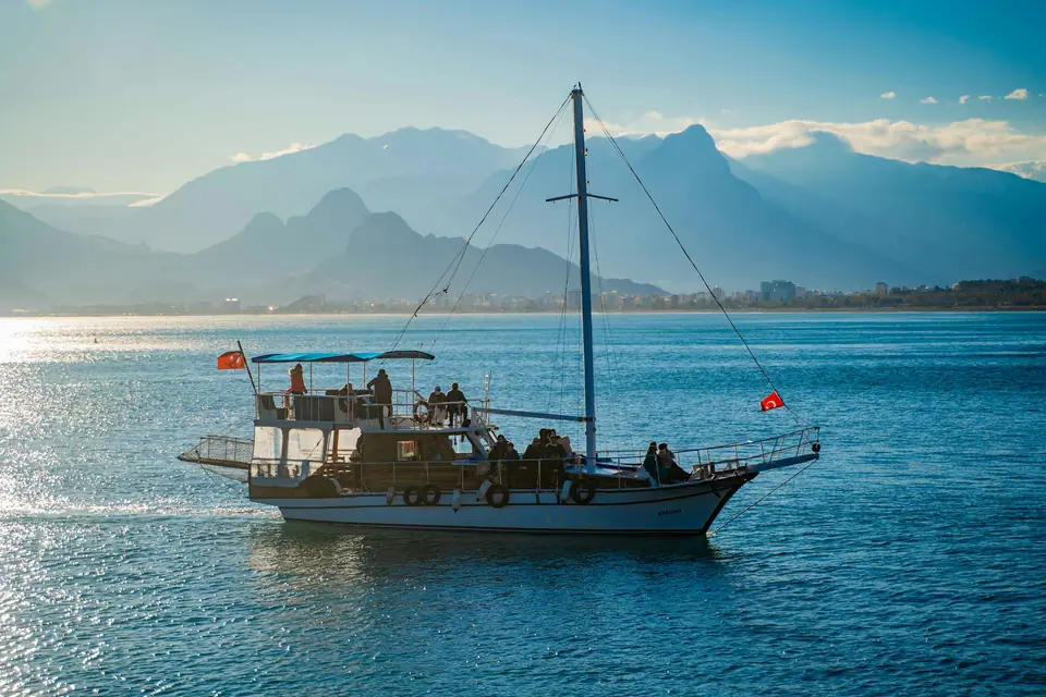 Wooden gulet on the Gulf of Antalya with the Taurus Mountains behind