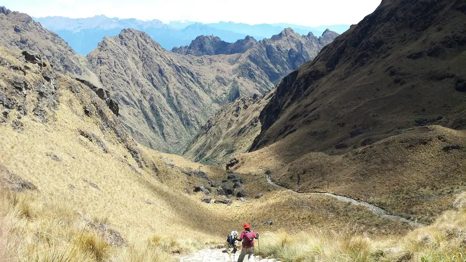 Hikers on the Inca Trail in a steep Andean valley