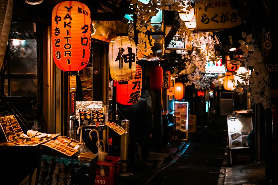 Lantern-lit izakaya alley in Tokyo at night