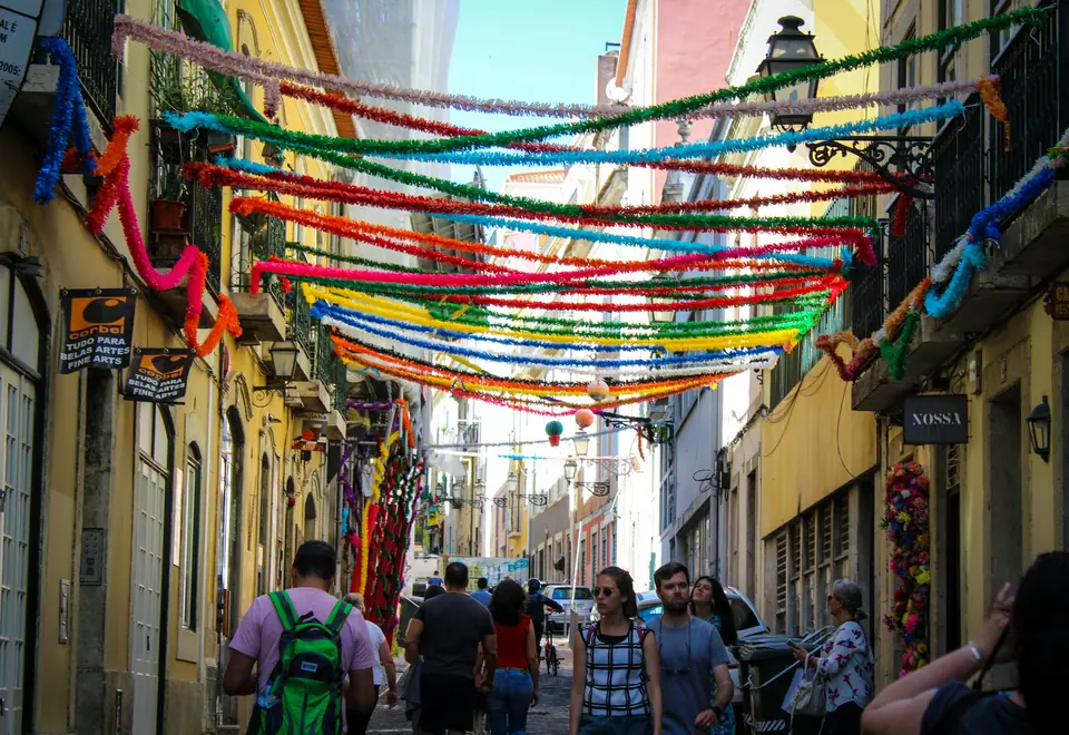 Colourful paper streamers strung over a Lisbon street during the June festivals