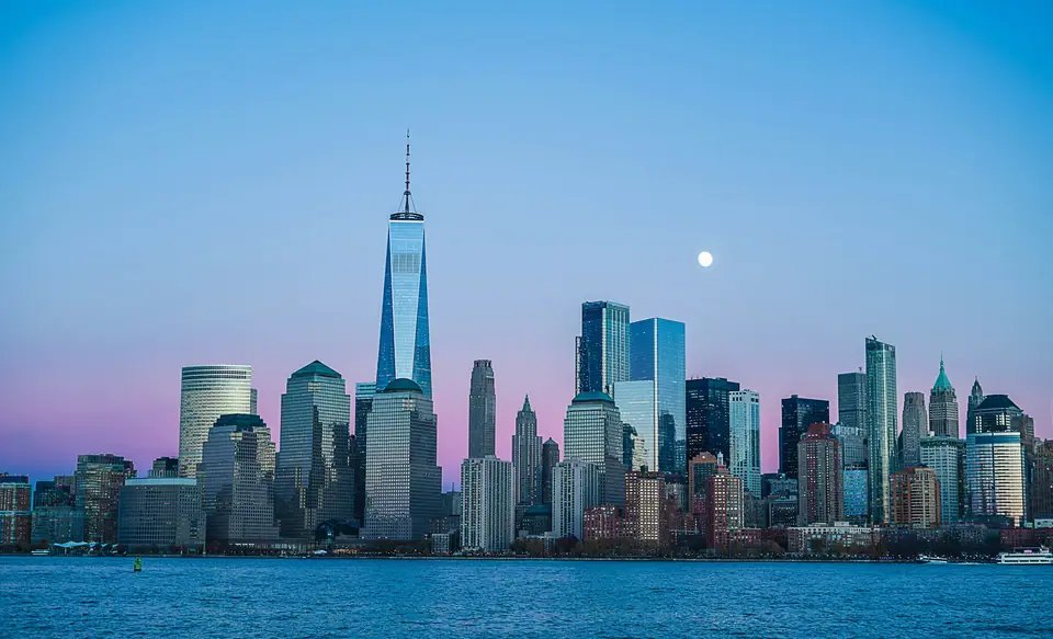 Lower Manhattan skyline across the water at dusk