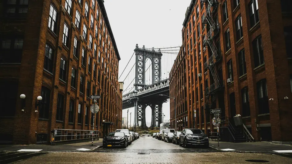 The Manhattan Bridge framed by brick buildings on Washington Street in DUMBO