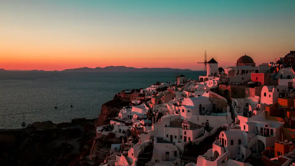 Sunset over Oia and its windmills