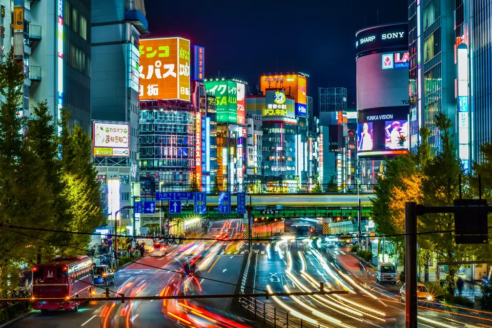Light trails and neon signs in Shinjuku at night